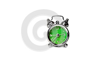 Green alarm clock over white