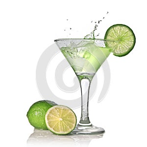 Green alcohol cocktail with splash and green lime