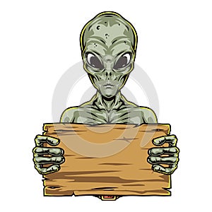 Green alien holding blank wooden board