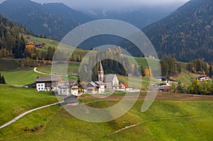 Green alpine valley with view of Santa Maddalena village church, Val di Funes, Dolomiti Mountains, Italy