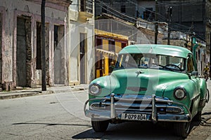 Green american classic car in the province Villa Clara
