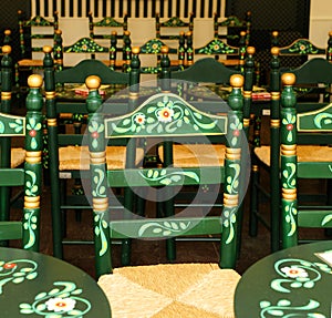 Green Andalusian chairs in a caseta in the famous Seville Fair of Seville, Spain photo