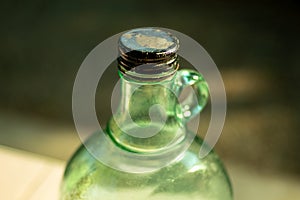 Green antique bottles and reflex light.