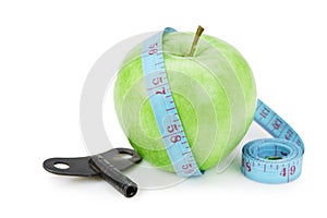 green apple and blue measure tape with clue isolated