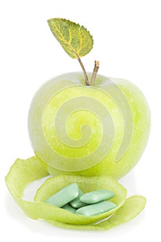 Green apple and bubble gum isolated on white background