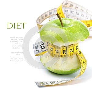 Green apple core and measuring tape