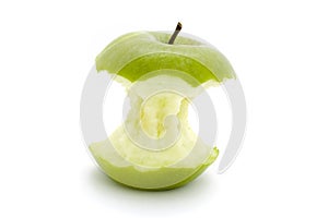 Green apple core over white