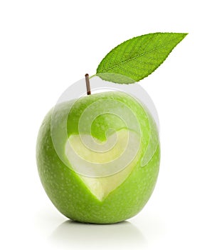 Green apple with cut heart