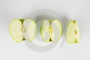 Green apple fruits, halves and slices