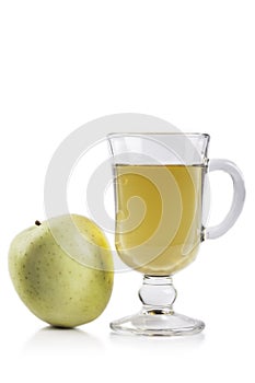 Green Apple and glass of juice isolated on white