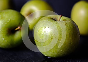 Green apple, isolated on black background