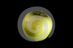 Green apple isolated over black