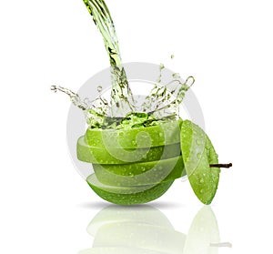 Green apple juice splashing with its fruits