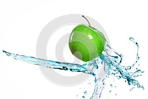 Green apple in juice stream