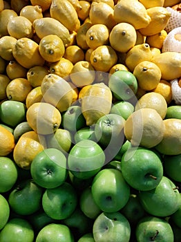Green apple and lemon at local store at fruit section