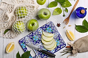 Green apple and lemon, on a wooden background. Top view flat lay