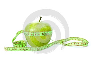 Green apple and measurement tape