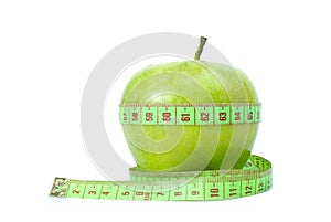 Green apple and measurement tape