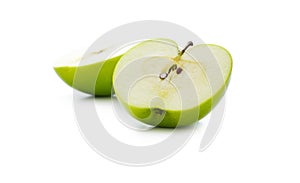 Green apple slice on white background, defocused