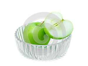 Green apple and slices in Glass bowl on white background with water drop, fruit Nourish the health body