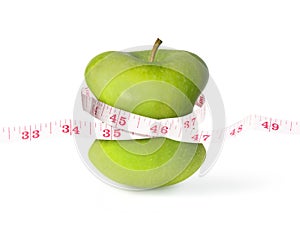 Green apple with slim waist and measuring tape