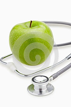 Green apple and a stethoscope