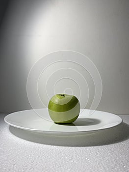 Green apple still life photo on white background