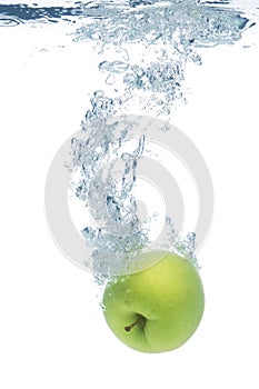 Green apple in water