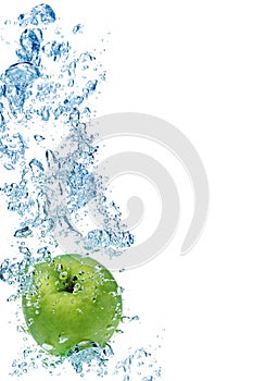 Green apple in water