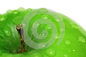 Green apple with water drops