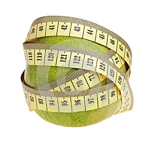 Green apple wrapped with yellow measurement tape.