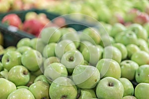 Green apples in a box in the store. green apples in boxes on market shelves. grocery shopping concept. healthy food.