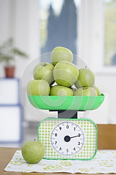 Green apples on kitchen scale food fruit