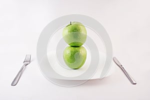 Green apples on a plate