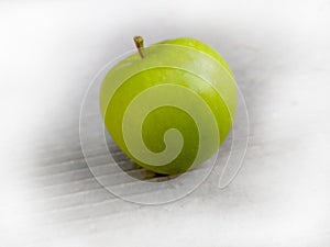 Green apples with shadows on white background