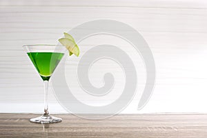 Green appletini cocktail in glass