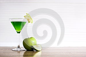 Green appletini cocktail in glass