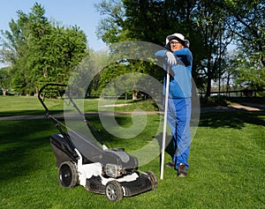 A green area maintenance worker resting during work image, maintenance of greenery
