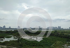 Green area, open space, skyline sepang malaysia and cloudy sky