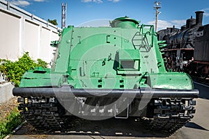 Green armored tracked military tractor