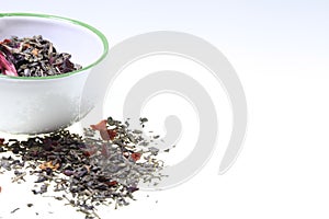 Green aromatized tea in a cup on a white background