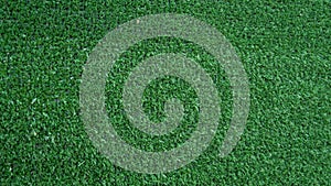 Green artificial grass. Football field, lawn, golf course, landscaping. Use for textures and backgrounds.
