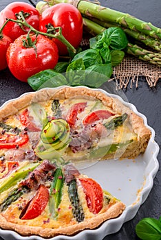 Green asparagi Tart with eggs and tomato