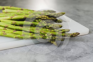 Green asparagus close-up on a cutting board