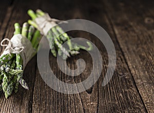 Green Asparagus (close-up shot) on wood