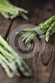 Green Asparagus (close-up shot) on wood