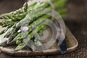 Green Asparagus close-up shot on wood