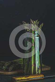 Green asparagus in glass jar