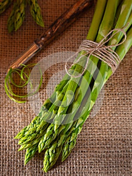 Green asparagus on a rustic background