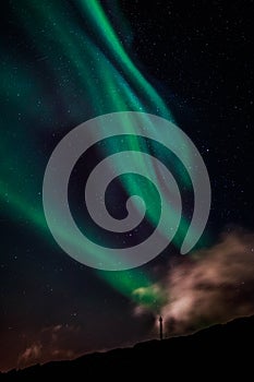 Green Aurora Borealis Northern lights shining with starlit sky, Nuuk, Greenland